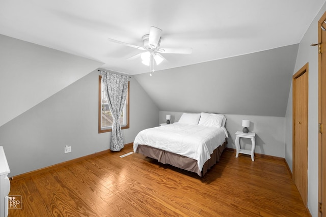 7314 W 113th Pl, Worth, IL 60482 - bedroom with light wood-style flooring, lofted ceiling, and ceiling fan