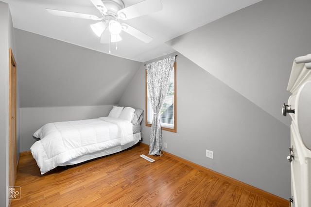7314 W 113th Pl, Worth, IL 60482 - bedroom with wood finished floors, lofted ceiling, and a ceiling fan