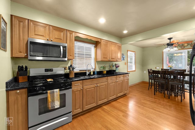 7314 W 113th Pl, Worth, IL 60482 - kitchen featuring appliances with stainless steel finishes, light wood-type flooring, recessed lighting, a ceiling fan, and dark stone counters