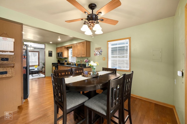 7314 W 113th Pl, Worth, IL 60482 - dining space featuring light wood finished floors, a ceiling fan, electric panel, and recessed lighting