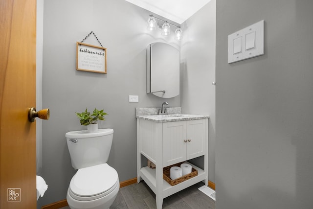 7314 W 113th Pl, Worth, IL 60482 - half bathroom featuring vanity and wood finished floors
