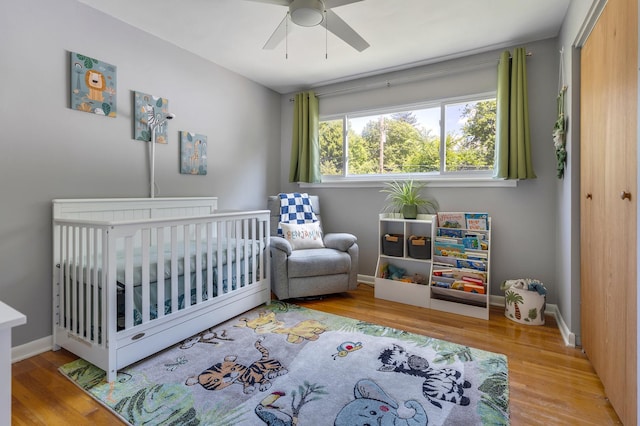 817 N Gibbons Ave, Arlington Heights, IL 60004 - bedroom featuring wood finished floors, a crib, a closet, and ceiling fan