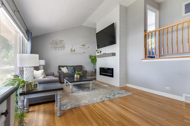 817 N Gibbons Ave, Arlington Heights, IL 60004 - living room with wood finished floors, a fireplace, and lofted ceiling