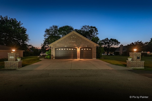 1913 N Woodlawn Park Ave, Mchenry, IL 60051 - view of front of home with brick siding, a yard, and concrete driveway
