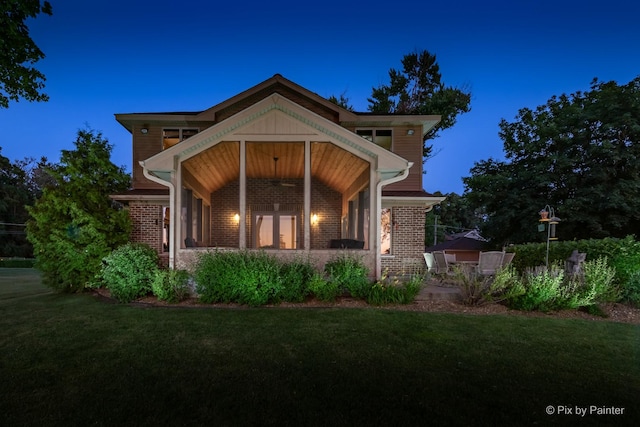 1913 N Woodlawn Park Ave, Mchenry, IL 60051 - rear view of house featuring a lawn and brick siding