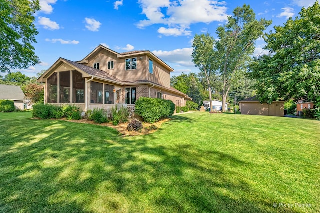 1913 N Woodlawn Park Ave, Mchenry, IL 60051 - rear view of house with a sunroom, a yard, and brick siding