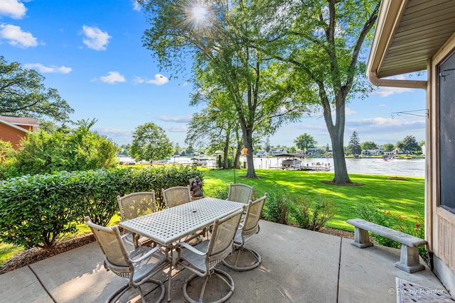 1913 N Woodlawn Park Ave, Mchenry, IL 60051 - view of patio featuring a water view and outdoor dining area