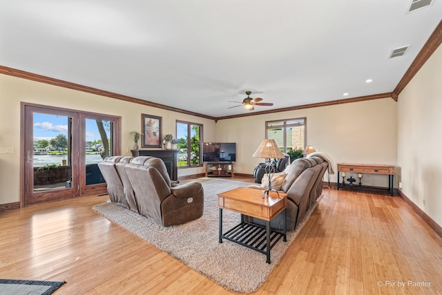 1913 N Woodlawn Park Ave, Mchenry, IL 60051 - living room with light wood-type flooring, ceiling fan, and ornamental molding