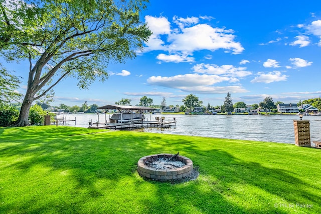 1913 N Woodlawn Park Ave, Mchenry, IL 60051 - dock area featuring a lawn, a fire pit, a water view, and boat lift