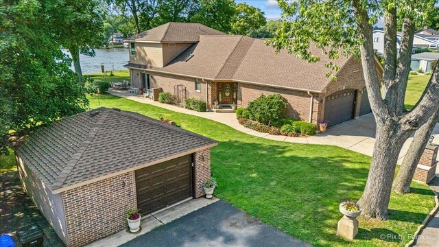 1913 N Woodlawn Park Ave, Mchenry, IL 60051 - view of front facade featuring brick siding, a front lawn, roof with shingles, and a water view