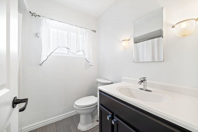 7004 W School St, Chicago, IL 60634 - full bathroom featuring vanity and toilet
