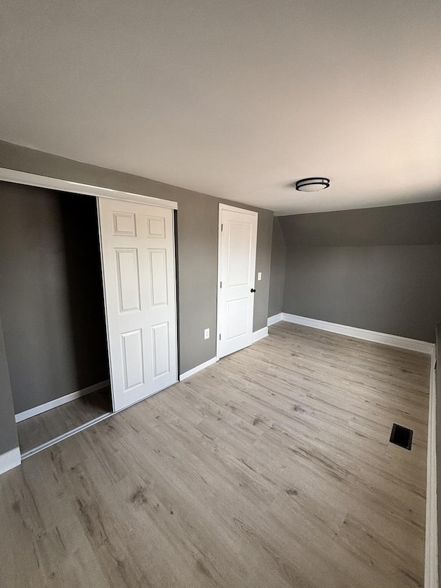 6638 S Albany Ave, Chicago, IL 60629 - unfurnished bedroom with wood finished floors and a closet