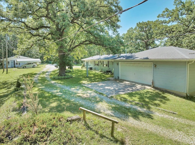 555/557 W Bluff St, Marseilles, IL 61341 - view of green lawn with an attached garage and driveway