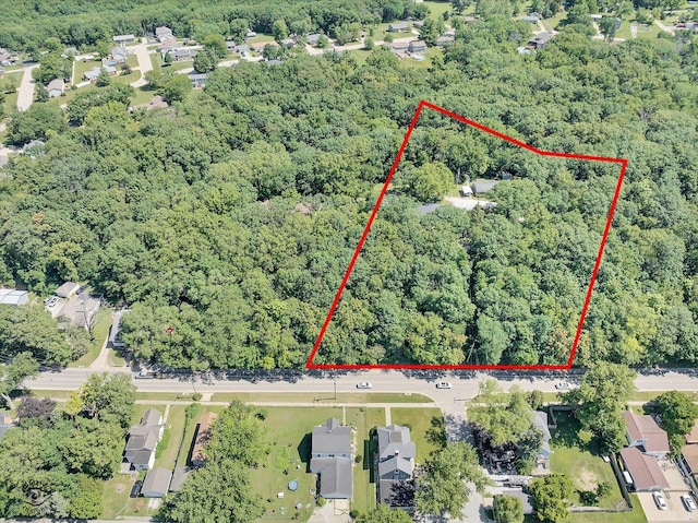 555/557 W Bluff St, Marseilles, IL 61341 - aerial view of property and surrounding area featuring a forest and property parcel outlined