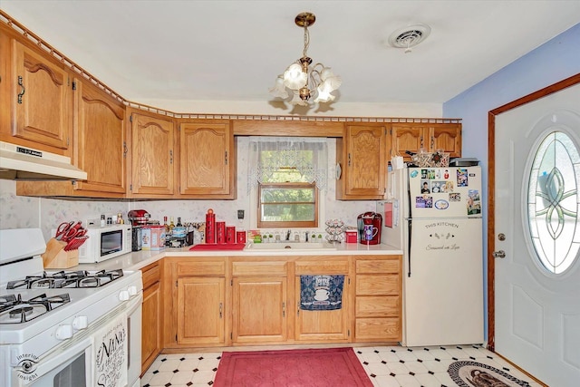 555/557 W Bluff St, Marseilles, IL 61341 - kitchen with white appliances, under cabinet range hood, a chandelier, and healthy amount of natural light
