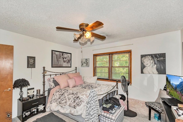 555/557 W Bluff St, Marseilles, IL 61341 - bedroom featuring carpet flooring, a textured ceiling, and a ceiling fan