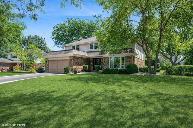 1355 W Kenilworth Ave, Palatine, IL 60067 - view of front facade featuring driveway, brick siding, and a front lawn