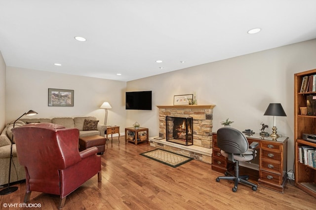 1355 W Kenilworth Ave, Palatine, IL 60067 - living area with wood finished floors, a stone fireplace, and recessed lighting
