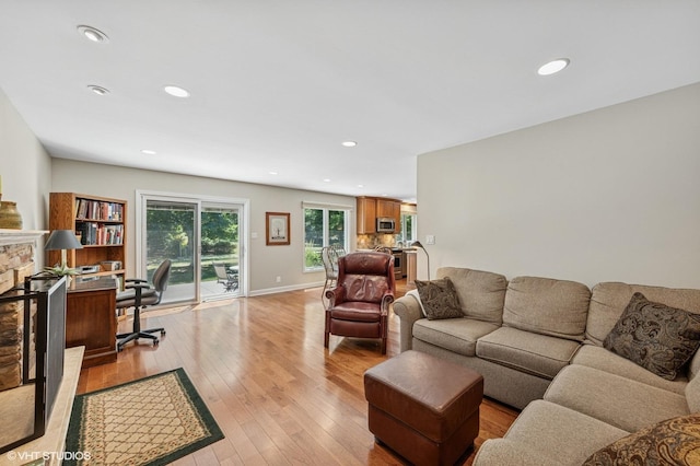 1355 W Kenilworth Ave, Palatine, IL 60067 - living area featuring light wood-style flooring, recessed lighting, a stone fireplace, and an office area