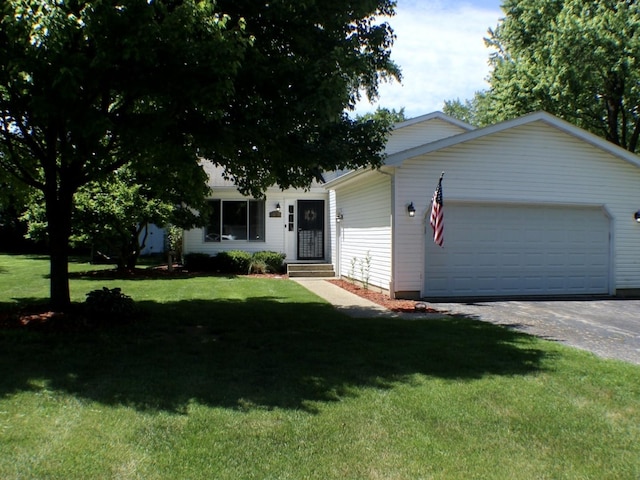 1615 Meadow Ln, Mchenry, IL 60050 - view of front of house featuring a garage, a front yard, and driveway