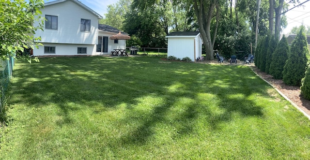 1615 Meadow Ln, Mchenry, IL 60050 - fenced backyard featuring a storage shed and a patio area