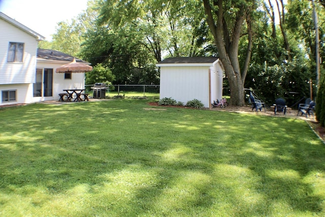1615 Meadow Ln, Mchenry, IL 60050 - fenced backyard featuring a storage shed and a patio area