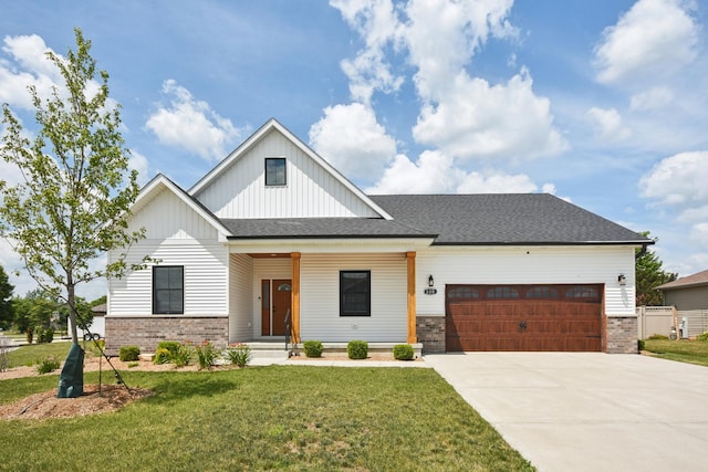 220 S Primrose Dr, Coal City, IL 60416 - modern farmhouse style home featuring board and batten siding, a garage, concrete driveway, a front yard, and brick siding