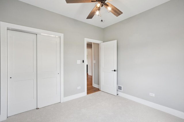 220 S Primrose Dr, Coal City, IL 60416 - unfurnished bedroom featuring carpet, a closet, and ceiling fan