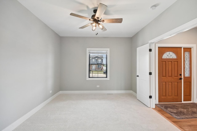 220 S Primrose Dr, Coal City, IL 60416 - foyer featuring a ceiling fan and light carpet