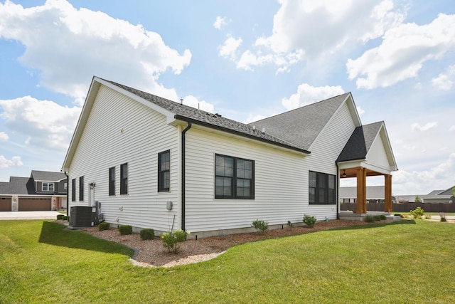 220 S Primrose Dr, Coal City, IL 60416 - rear view of property featuring a yard and roof with shingles