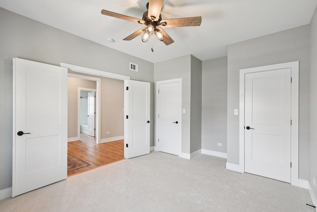 220 S Primrose Dr, Coal City, IL 60416 - unfurnished bedroom with light carpet and ceiling fan