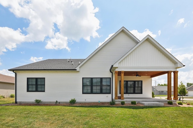 220 S Primrose Dr, Coal City, IL 60416 - rear view of property with a ceiling fan, a yard, a shingled roof, and board and batten siding