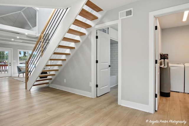312 Country Club Dr, Mchenry, IL 60050 - stairs featuring washer and dryer and wood finished floors