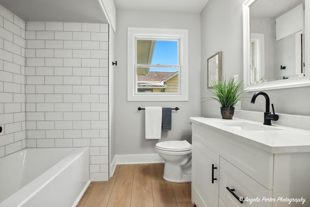 312 Country Club Dr, Mchenry, IL 60050 - bathroom featuring vanity, wood finished floors, and shower / tub combination