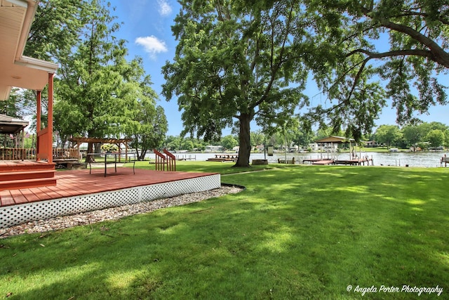 312 Country Club Dr, Mchenry, IL 60050 - view of green lawn featuring a deck with water view