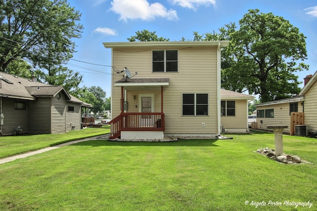 312 Country Club Dr, Mchenry, IL 60050 - rear view of house featuring a lawn