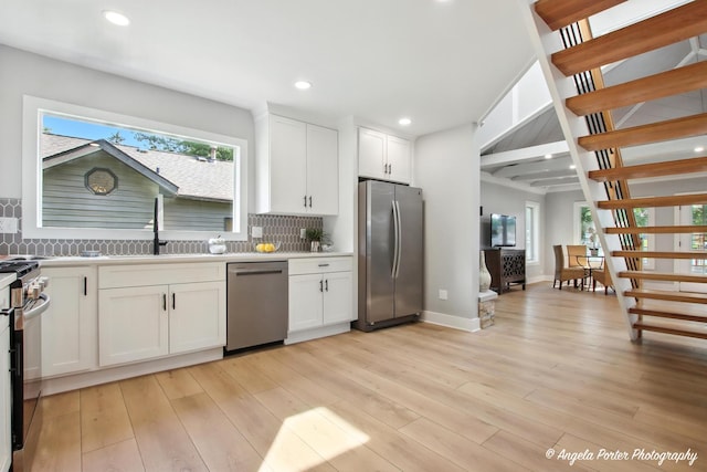 312 Country Club Dr, Mchenry, IL 60050 - kitchen featuring appliances with stainless steel finishes, tasteful backsplash, white cabinetry, and recessed lighting
