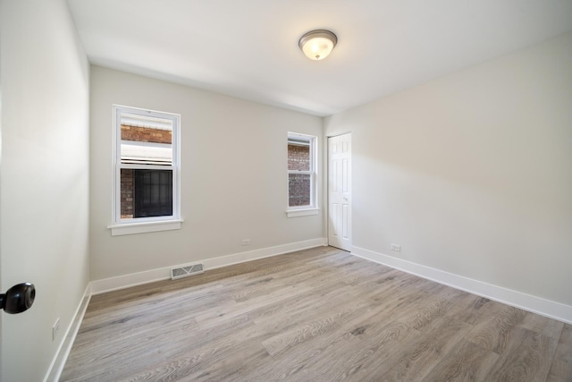 8858 S Calumet Ave, Chicago, IL 60619 - spare room with light wood finished floors and baseboards