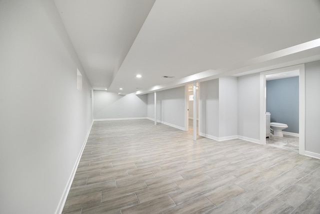8858 S Calumet Ave, Chicago, IL 60619 - finished below grade area with light wood-style flooring and recessed lighting