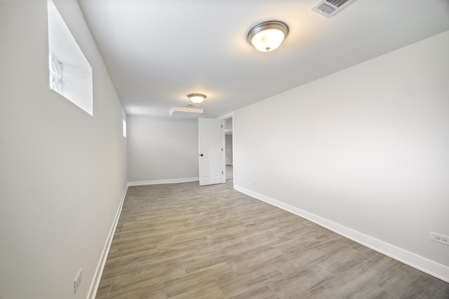 8858 S Calumet Ave, Chicago, IL 60619 - unfurnished room with baseboards and light wood-style flooring