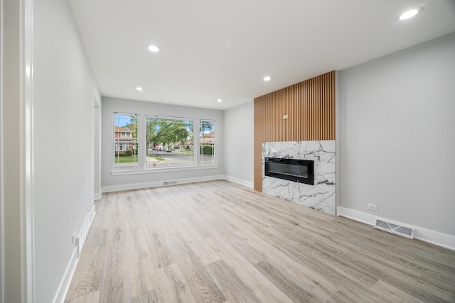 8858 S Calumet Ave, Chicago, IL 60619 - unfurnished living room featuring recessed lighting, wood finished floors, and a high end fireplace