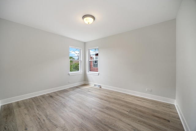 8858 S Calumet Ave, Chicago, IL 60619 - empty room with wood finished floors
