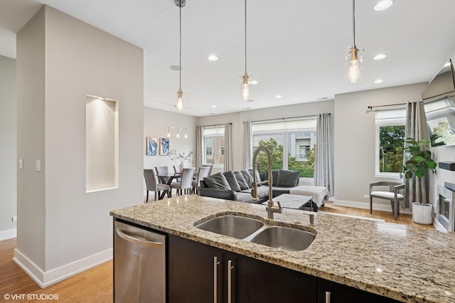 3516 N Ashland Ave N Unit 3S, Chicago, IL 60657 - kitchen with stainless steel dishwasher, light wood-style floors, hanging light fixtures, recessed lighting, and open floor plan