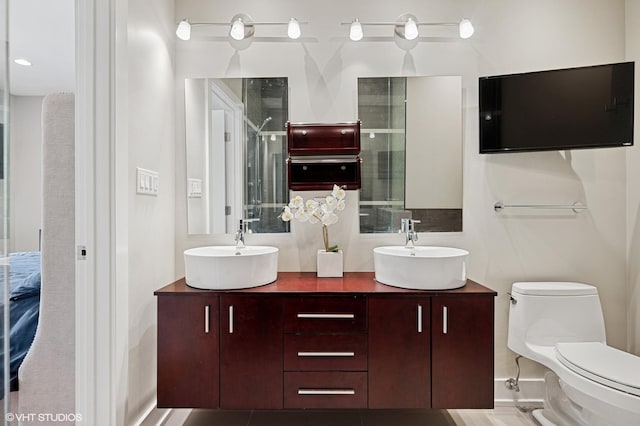 3516 N Ashland Ave N Unit 3S, Chicago, IL 60657 - bathroom featuring double vanity and a shower with shower door