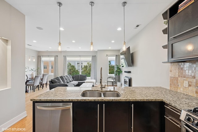 3516 N Ashland Ave N Unit 3S, Chicago, IL 60657 - kitchen with open floor plan, light wood finished floors, backsplash, recessed lighting, and light stone counters