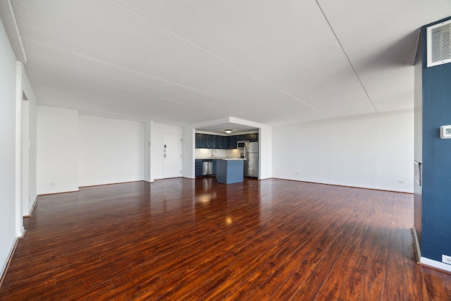 2005 S Finley Rd Unit 1204, Lombard, IL 60148 - unfurnished living room with dark wood-type flooring and baseboards