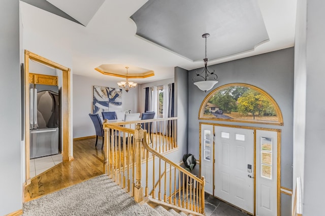 5147 Fairground Ct, Monee, IL 60449 - entryway with a raised ceiling, a chandelier, stairs, and wood finished floors