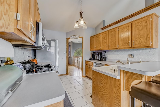 5147 Fairground Ct, Monee, IL 60449 - kitchen with a peninsula, backsplash, light countertops, light tile patterned floors, and vaulted ceiling