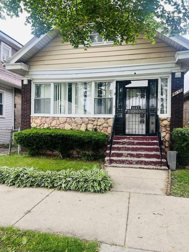 8137 S Bennett Ave, Chicago, IL 60617 - view of front of property with stone siding