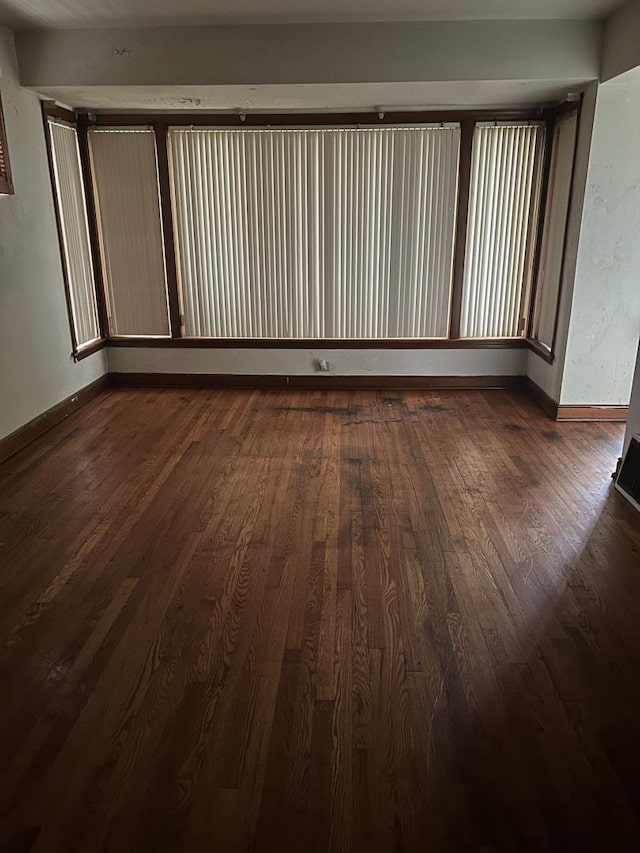 1513 E 86th Pl, Chicago, IL 60619 - empty room with dark wood finished floors and baseboards